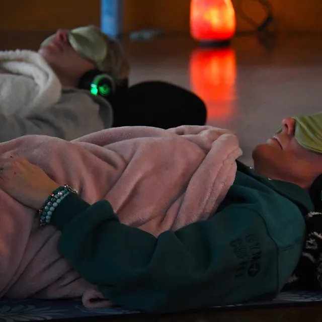 someone resting in the warm light of a salt lamp